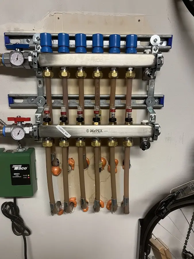 Plumber performing Water Heater Repair at a residential property in Tipton